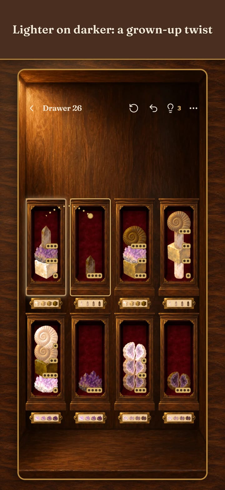 Lighter on darker: a grown-up twist. A Minerals level in shade order, with a hint shown as a pulsing drawer and a dotted arc to another